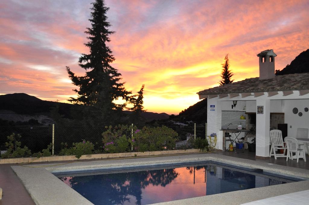 Couple enjoying a luxury villa with a private pool overlooking the ocean